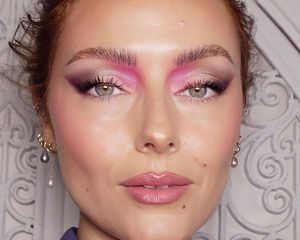 Katie Jane Hughes wears a shimmery pink, white, and black graphic eyeshadow look
