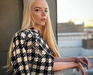 Anya Taylor-Joy in black and white jacket