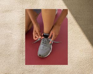 tying shoes on background