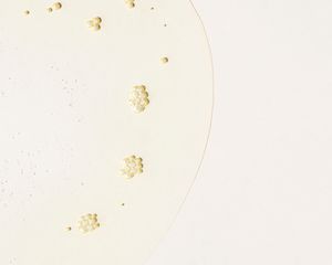 close up of baby oil on white background