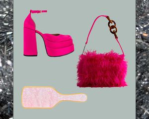 Platform pink shoes, feather pink purse, and pink paddlebrush