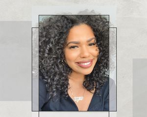 Digital Creator Ty Lauren Smiling at Camera in a Selfie with Natural Hair Texture, Subtle Eye Makeup and Nude Lipstick