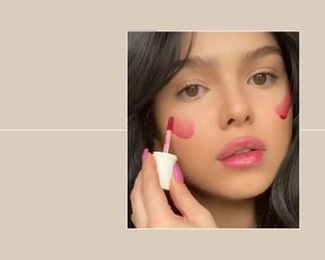 Woman using Benetint blush