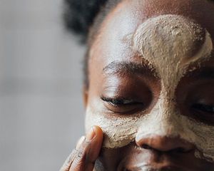 woman with clay mask