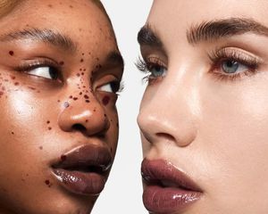 Two models wearing black lipgloss