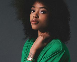 Model wearing a gold Breda watch.