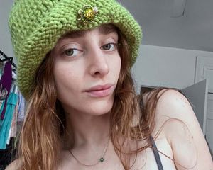 Jo Rosenthal wearing a knit hat with a brooch pin