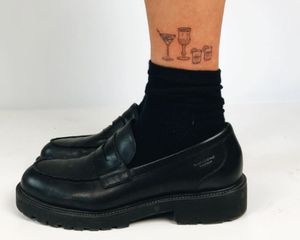 Ankle tattoo of four cocktails
