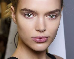 Model with full brows and clear skin