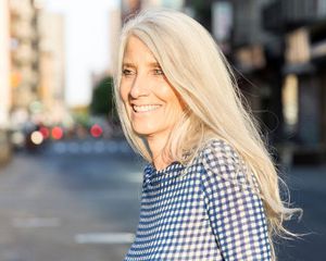 a smiling, 50-something woman