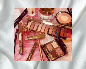 charlotte tilbury products on pink background