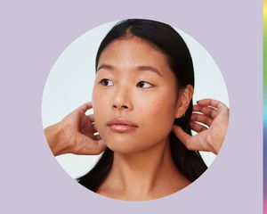 Woman pulling hair back