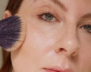 A close up of the author, Ashley Rebecca, blending her contour.