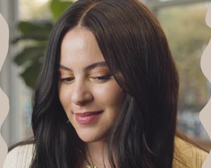 byrdie senior social editor star donaldson poses for a photo wearing a wig for crowned