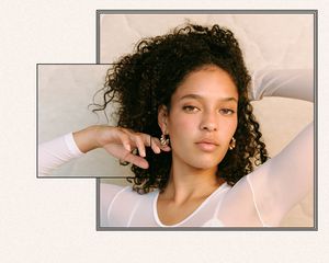 Close up of a woman with very curly hair.