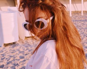 woman with sunglasses on the beach