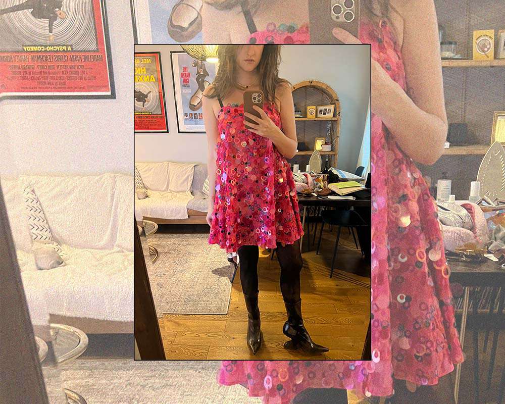 Erika Harwood wearing a pink sequin mini dress and black ankle boots