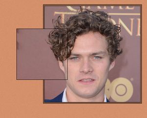 Actor Finn Jones with curly hair