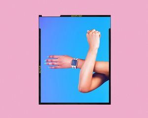 Arms mid-stretch, with a fitness tracker on one of the wrists.