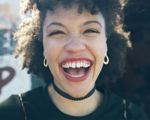 happy laughing curly girl