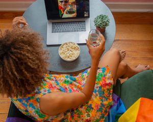 woman in colorful dress on zoom call