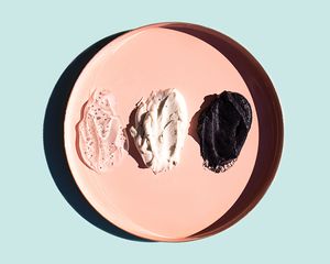 Scrub or beauty facial masks smears on pastel pink plate