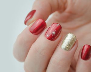 Red and gold holiday manicure