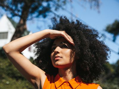 Woman shielding her eyes from the sun