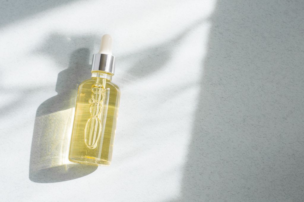 Yellow oil on a white background