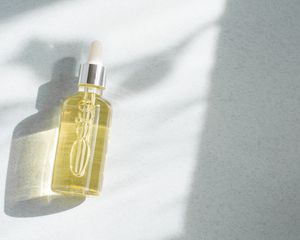 Yellow oil on a white background