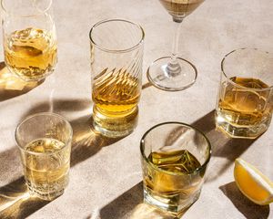 Table with glasses of various alcoholic drinks