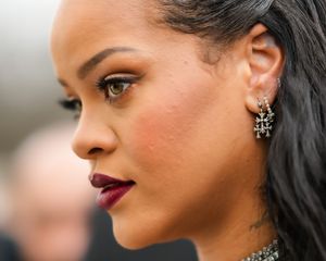 Rihanna wears winged liquid liner and burgundy lipstick
