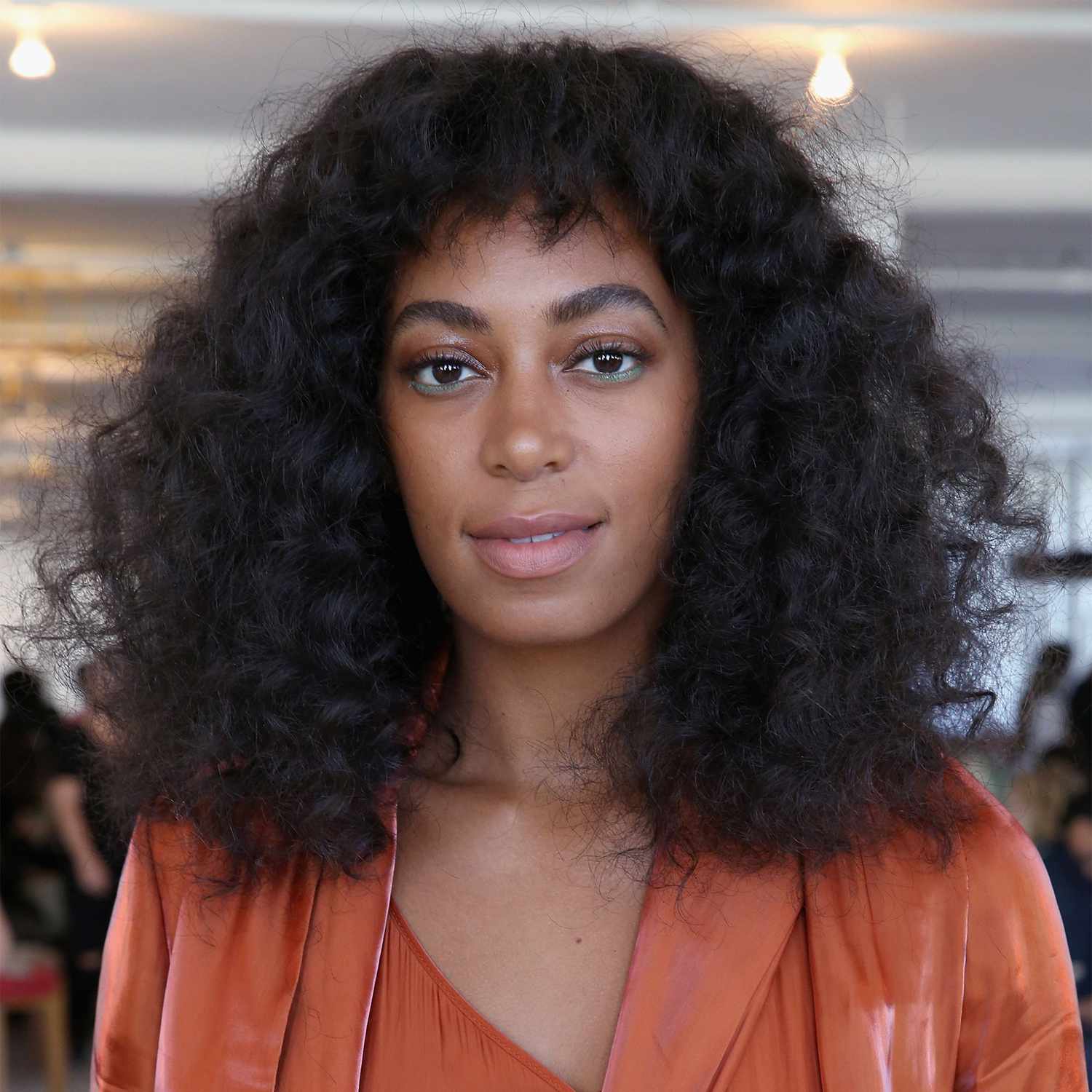 Solange with curly hair and baby bangs