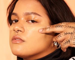 woman putting on foundation