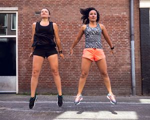 two women jumping