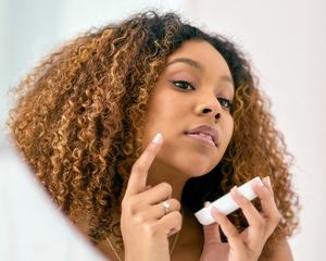 Woman applying cream
