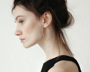 woman with updo and earring