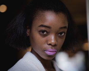 woman with matte purple lipstick