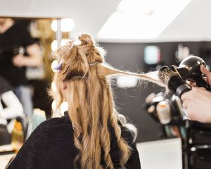 Woman getting her hair curled