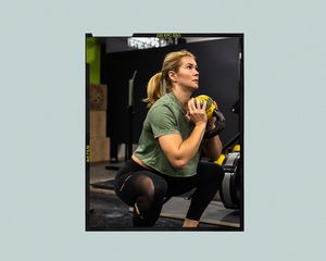 Woman performing a goblet squat at the gym.