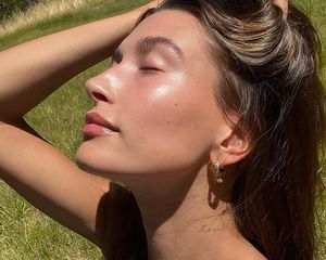 Hailey Bieber in a field 