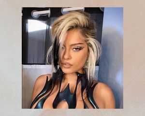 Bebe Rexha wears a white blonde updo with black dip-dyed roots
