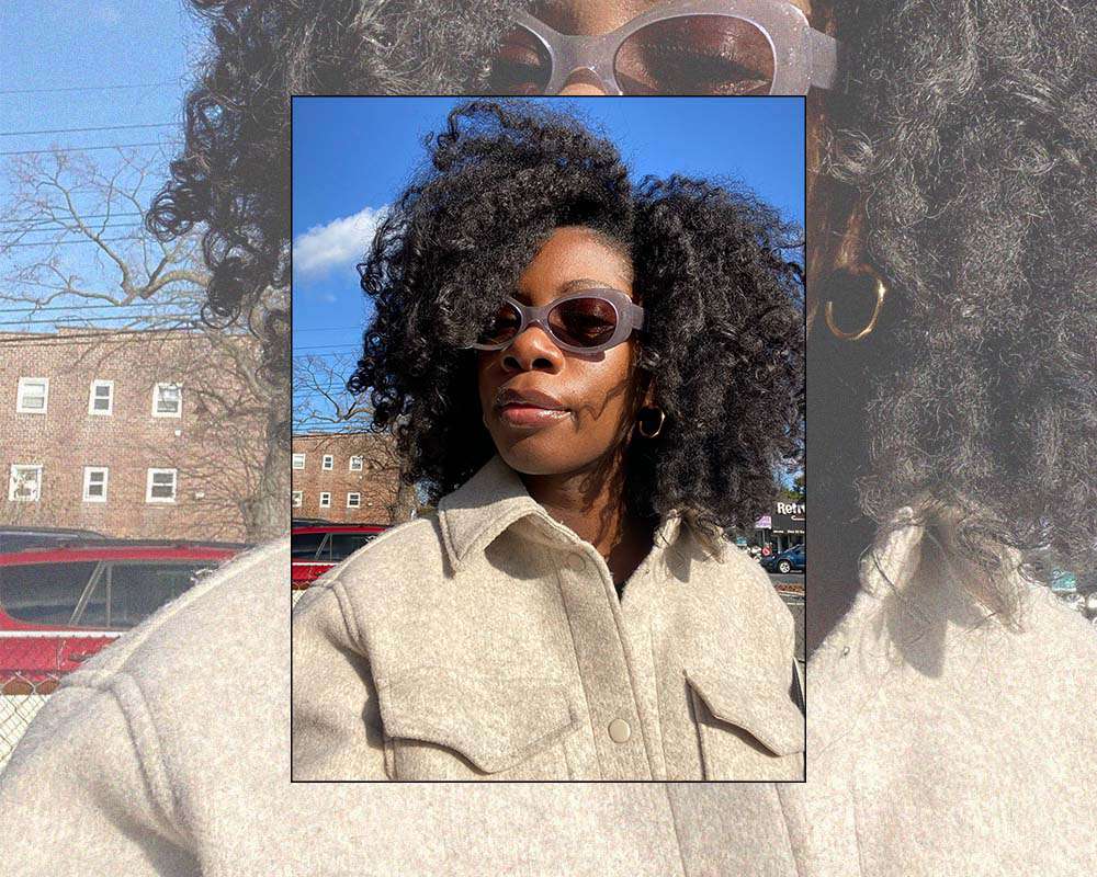 Jasmine Phillips wearing sunglasses and a tan shacket