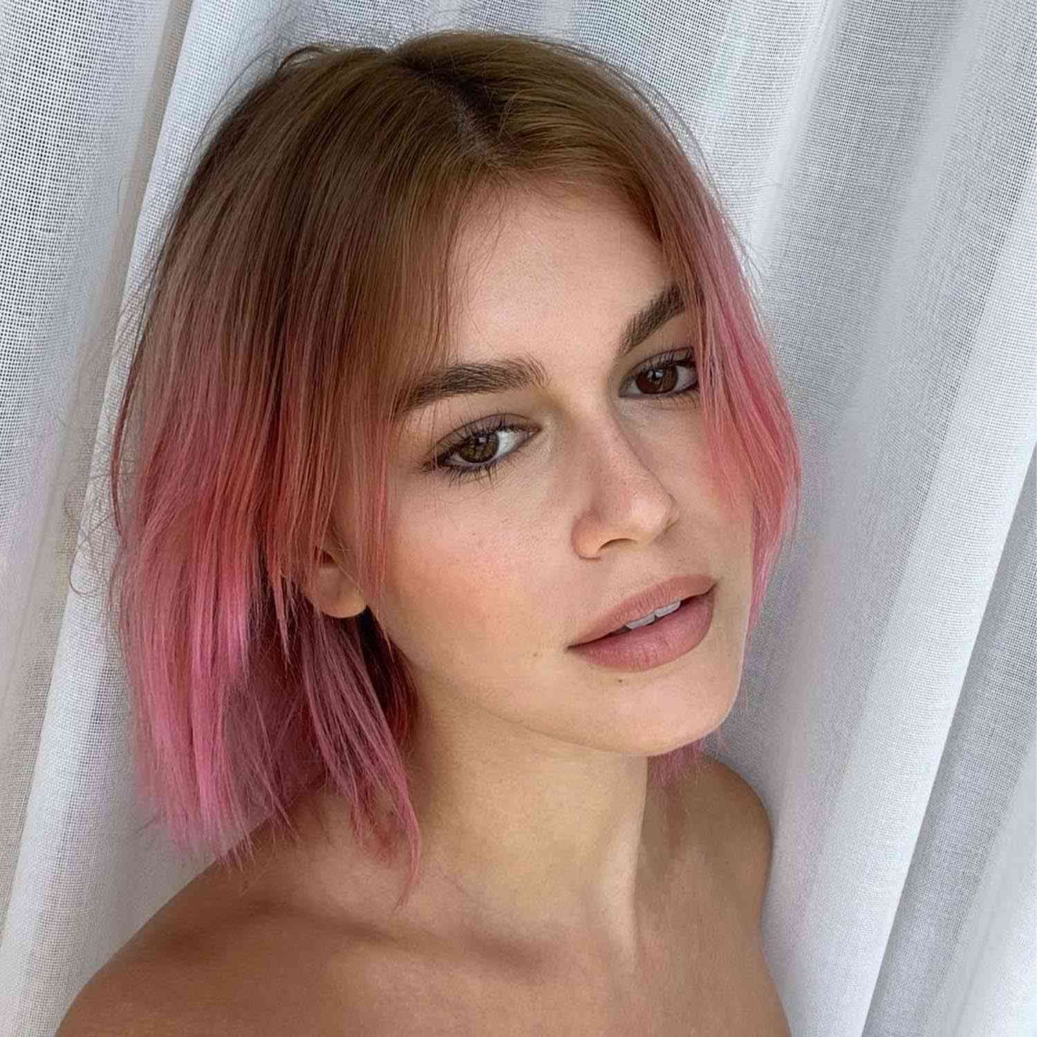 Kaia Gerber with pink hair and subtle eyeliner 