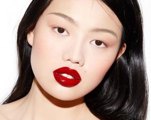 model with matte skin and red lips