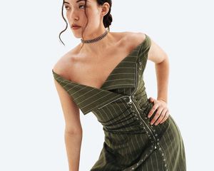 Model wearing green pinstriped Miaou dress.