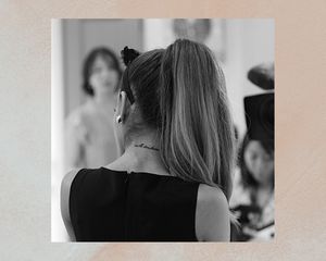 Ariana Grande from the back, neck tattoo visible