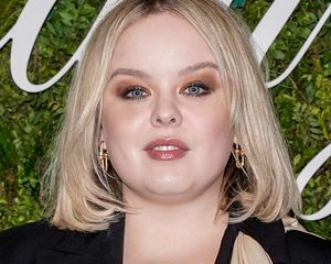 Nicola Coughlan with blonde hair and bronze eyeshadow 