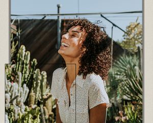 woman smiling in greenery