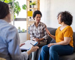 LGBTQIA+ couple solving relationship problems in therapy